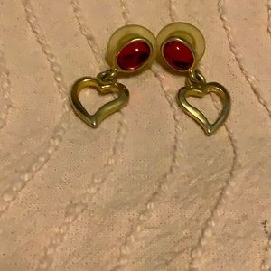 Heart shaped earrings with red stone.